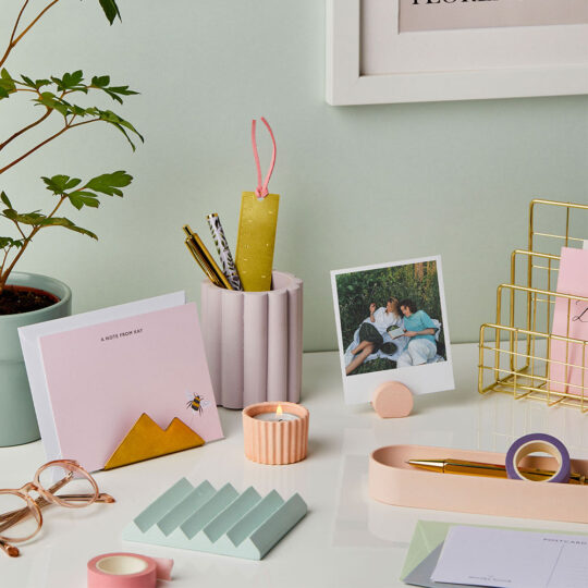 martha brook pastel desk accessories on a white desk