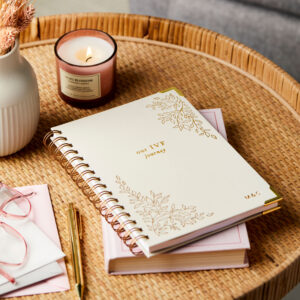 martha brook personalised ivf journal on side table with a candle